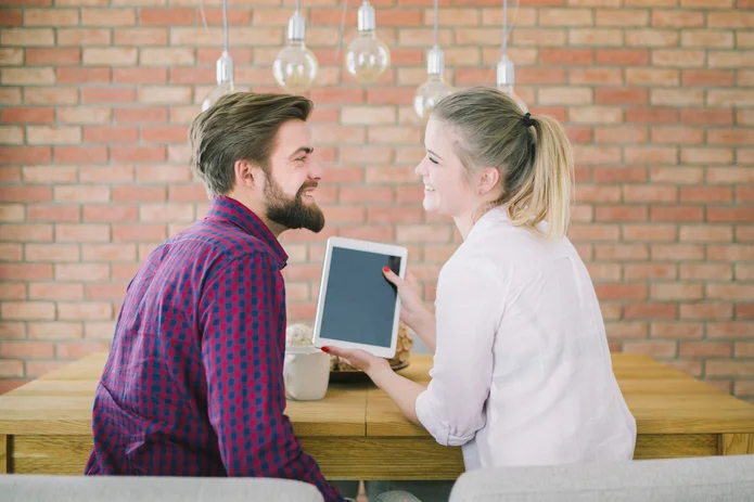 young-couple-with-tablet-table